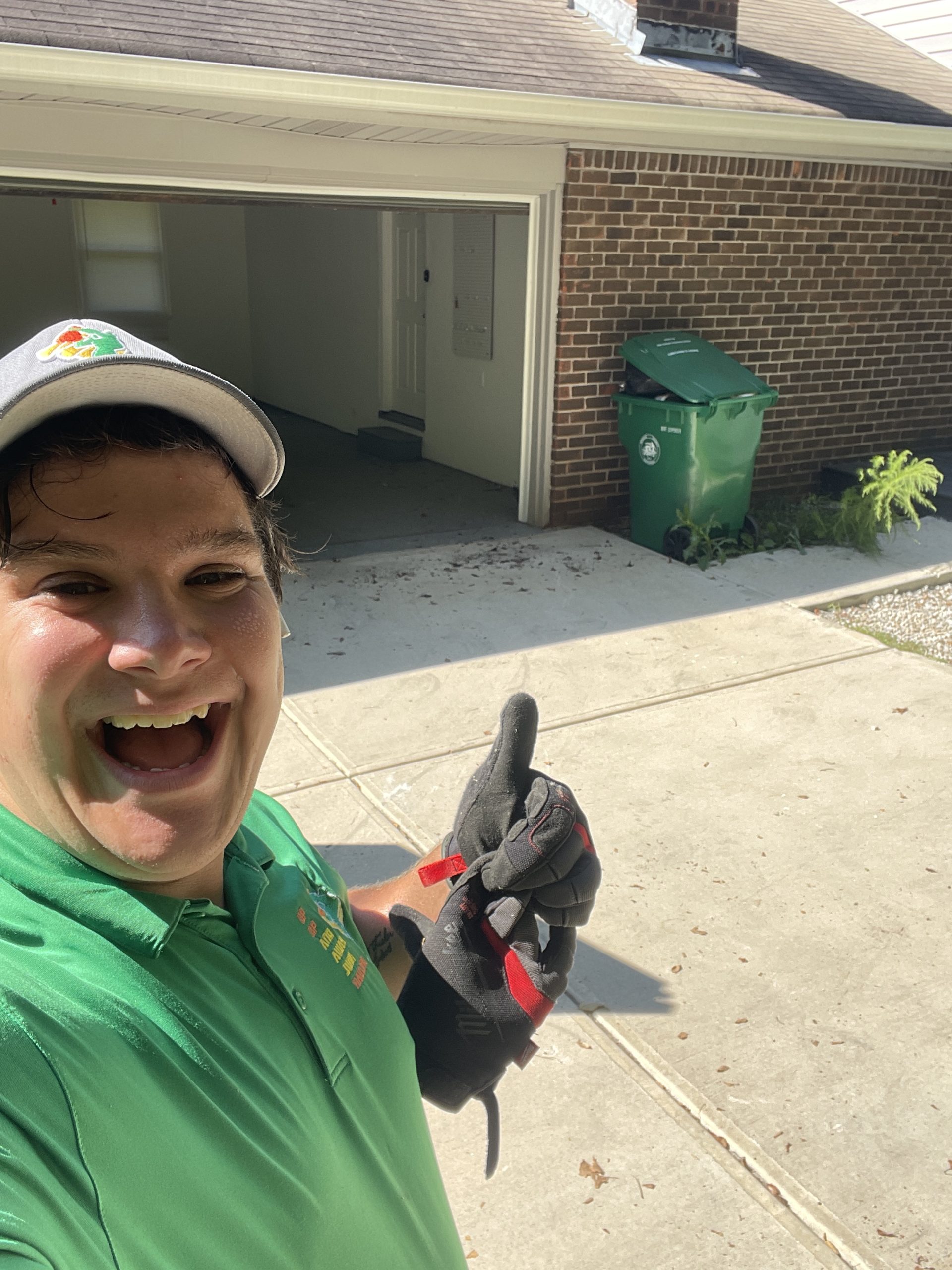 A guy taking a selfie in the garage